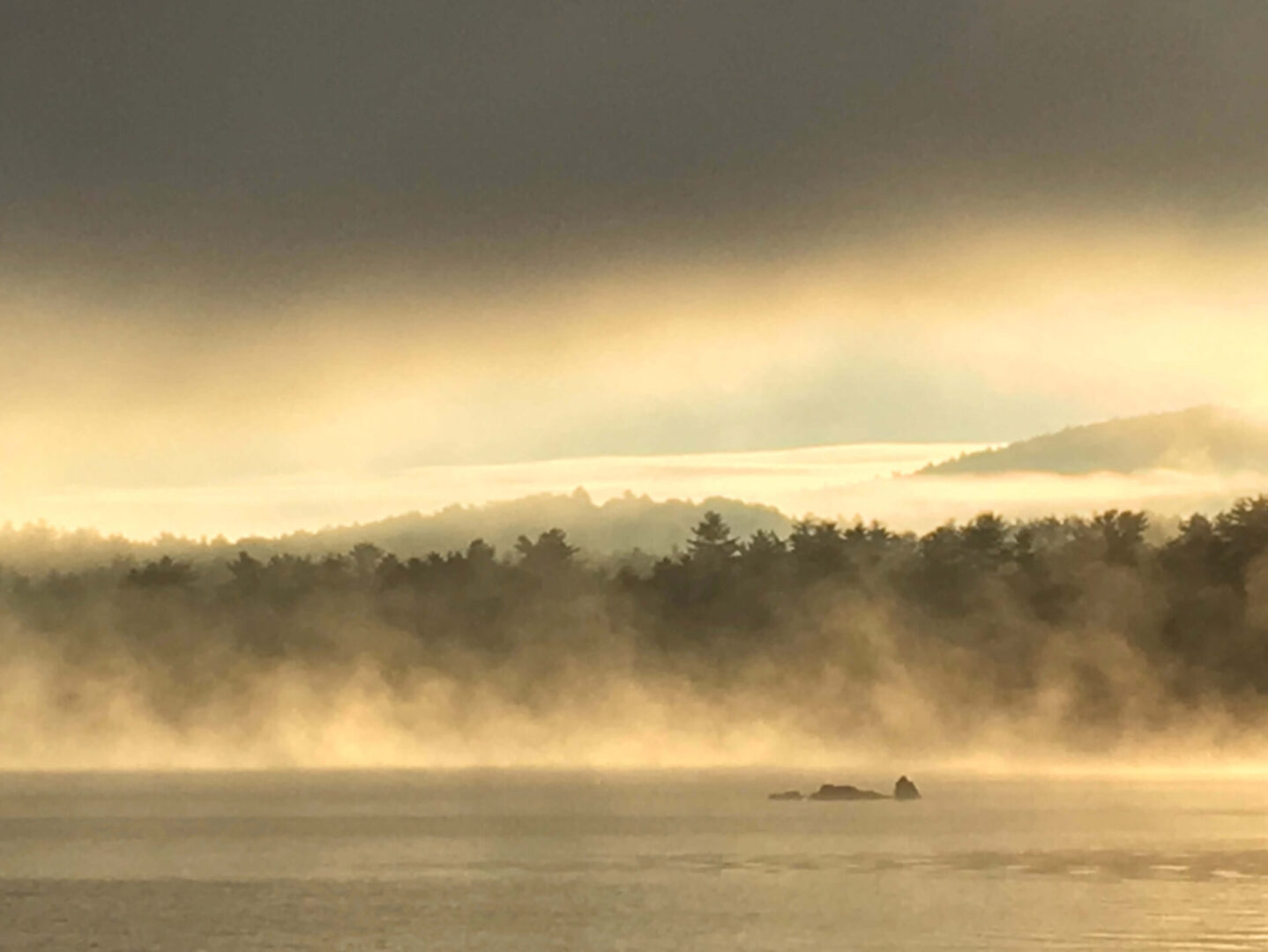 Early morning, Autumn sun on a misty lake